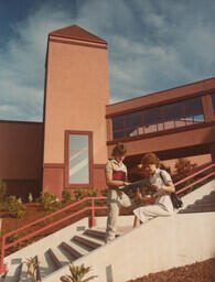 Students posing for a publicity shoot, holding the 1983/84 Fraser Valley College calendar, on the brand new Abbotsford campus on King Road. Dale Weir and Noelle Bourget. DO NOT USE.