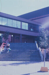 Woman on Abbotsford campus steps